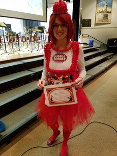 Teacher in a Double Bubble costume with pink tutu and wig