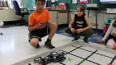 Photo of students controlling a robot