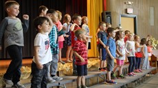 Kindergarted students on stage dancing