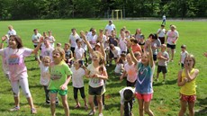 Photo of group of kids covered in paint