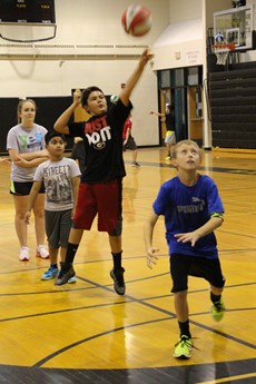 Photo of children playing basketball