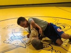 Two children wrestling