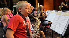 Young boy playing a saxophone