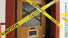 Caution tape over a door