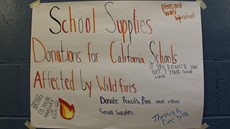 Wildfire relief sign taped on a wall