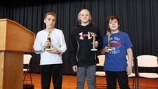 Eli Scales, Maryanne Tuttle and Scott Beach holding their trophies