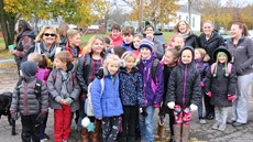 A group of children and adults smiling