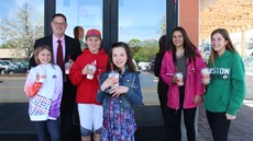 Dr. Andrews and five students standing outside of CoreLife