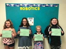 Cassandra Groome, Brionna Blanchard, Anne Coleman and Sophie Carlin holding certificates