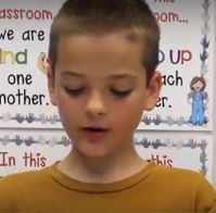 Young boy looking down