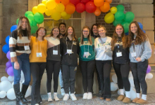 Group of teenagers in front of balloons