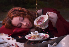 Picture of girl lying down with tea cup