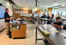 Teacher at the front of a classroom
