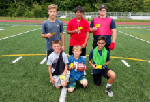 six boys on a football field