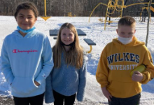 Three children on a playground