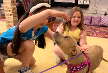 Two girls and a dog