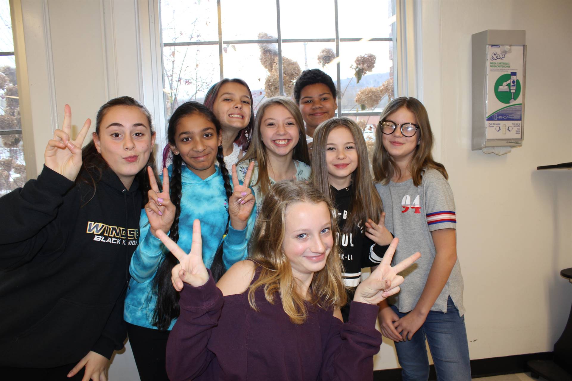 Eight girls smiling