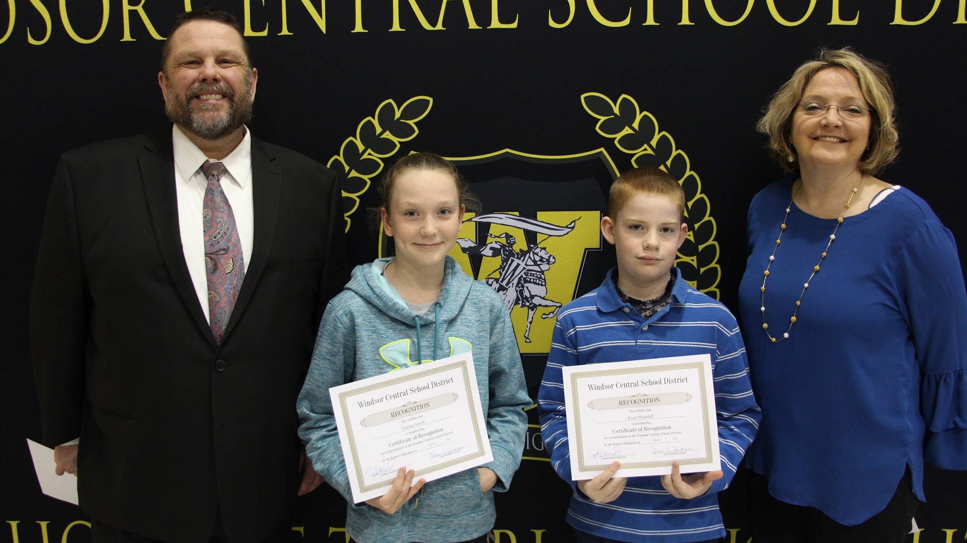 Pete Nowacki, a young girl, a young boy, and Margo Kibbler