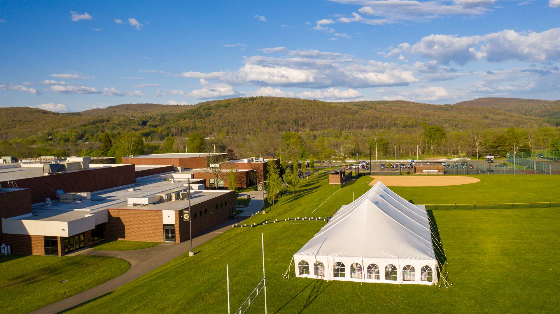 Arial view of high school and softball field with tent