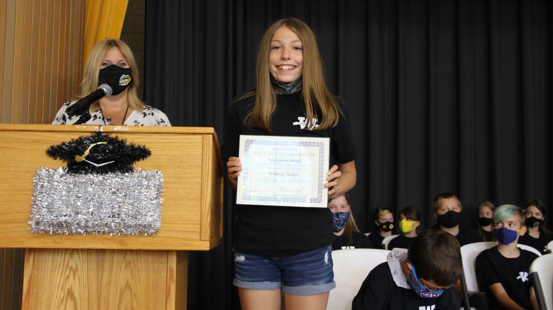 Young girl holding a certificate