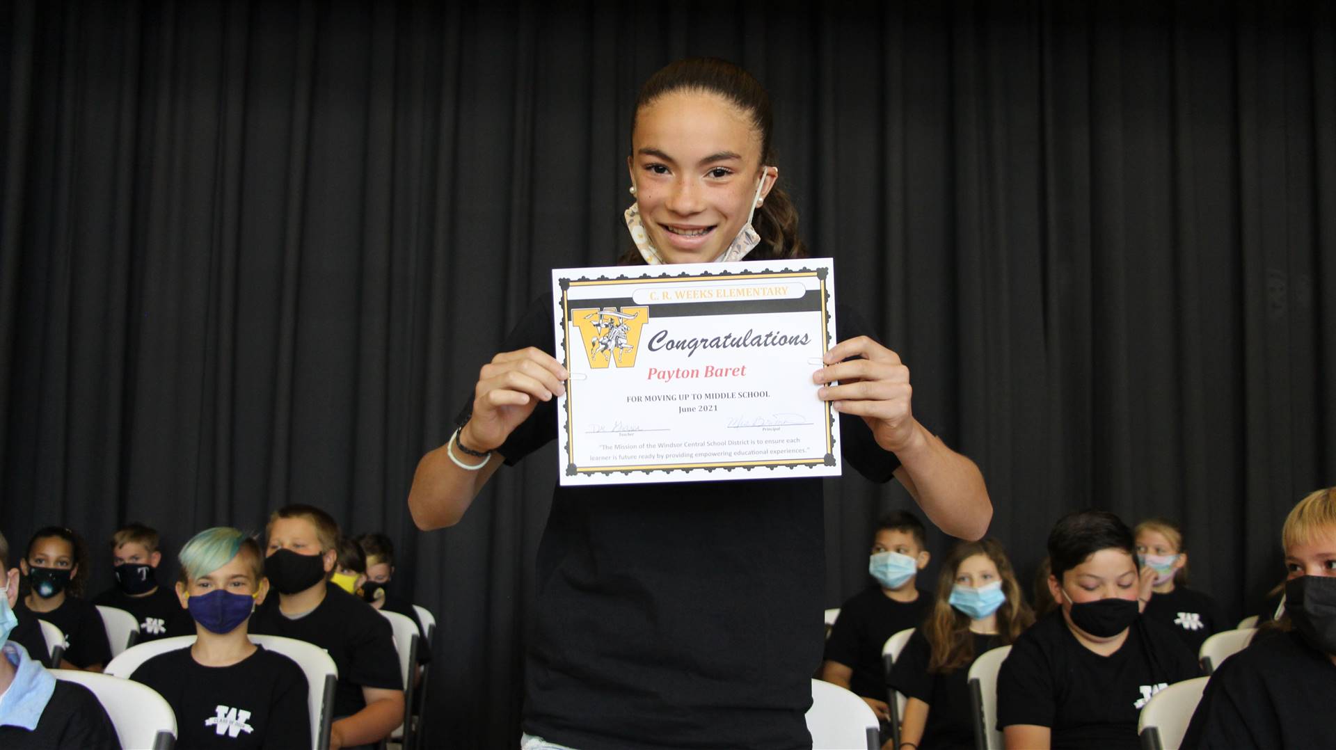 Young girl holding a certificate