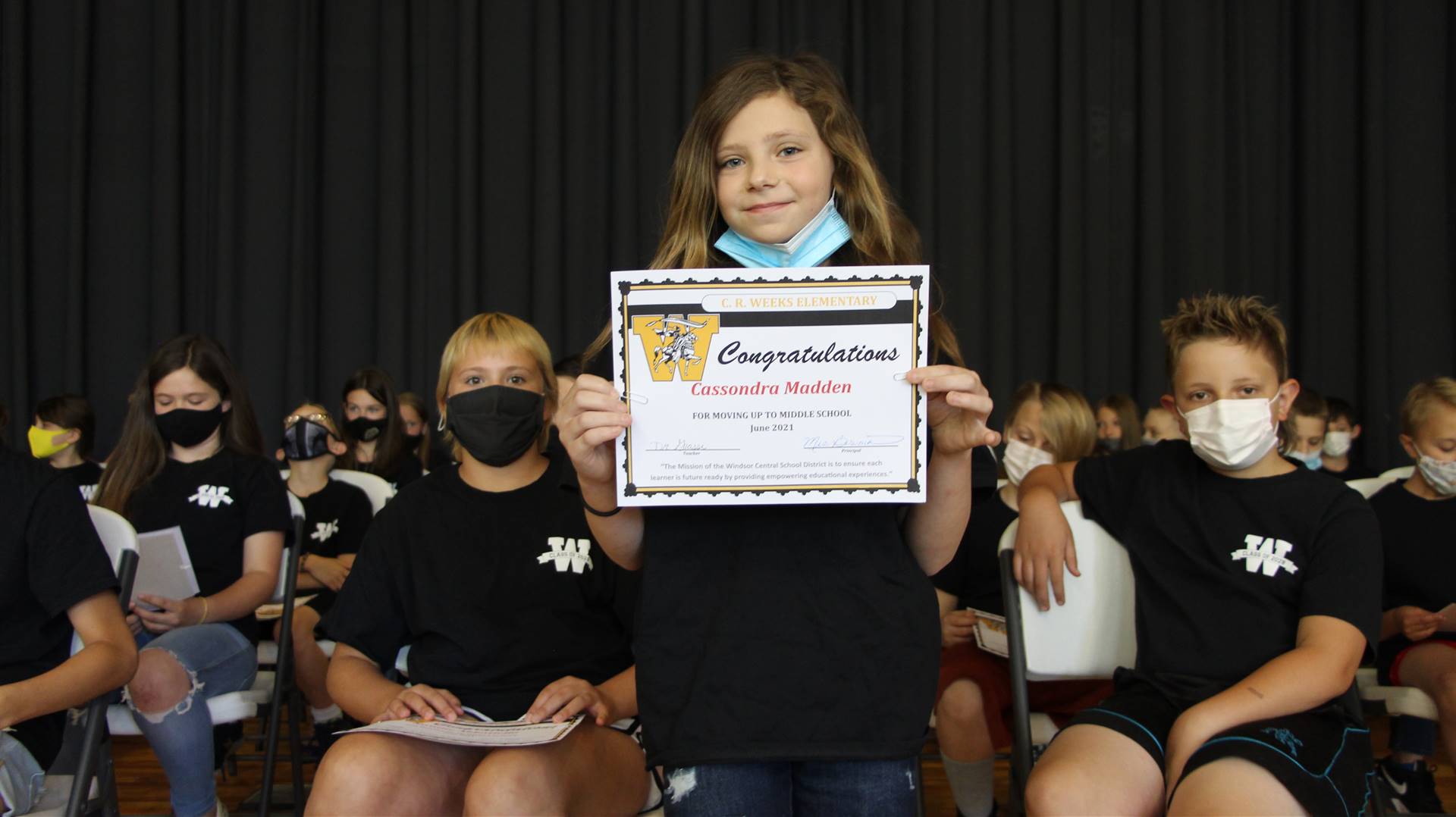 Young girl holding a certificate