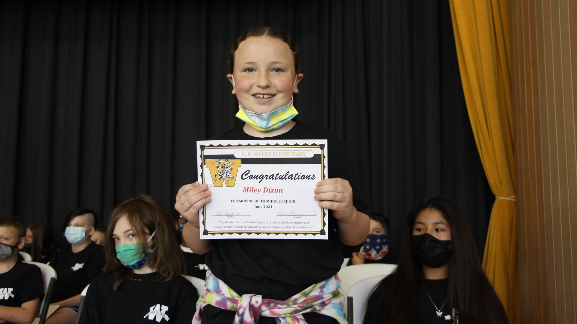 Young girl holding a certificate