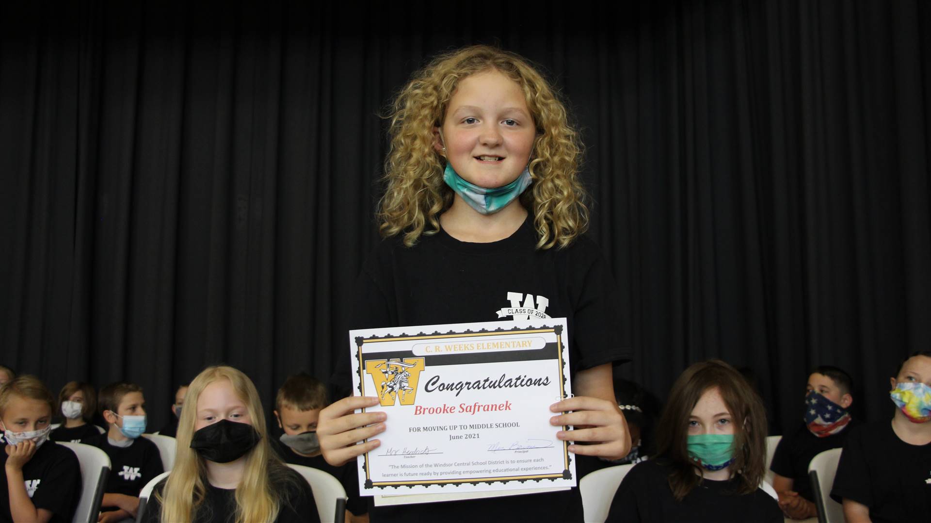 Young girl holding a certificate